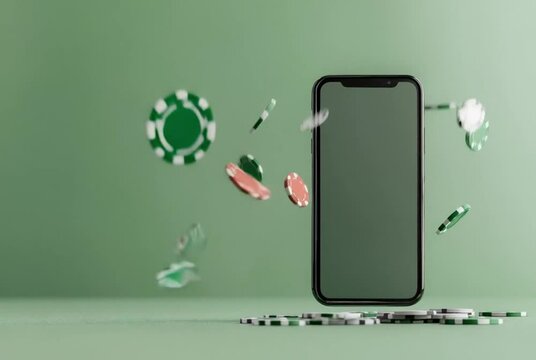 Smartphone displaying online casino gambling with falling poker chips