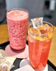 A delightful assortment of desserts displayed in a cozy cafe setting, featuring cakes, pastries, and sweet treats on elegant plates, creating a warm and inviting atmosphere.
