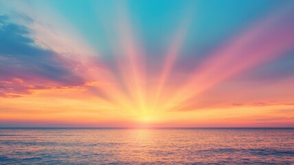 Obraz premium A vibrant sunset illuminates the ocean, casting colorful rays across the sky, creating a serene and picturesque landscape.