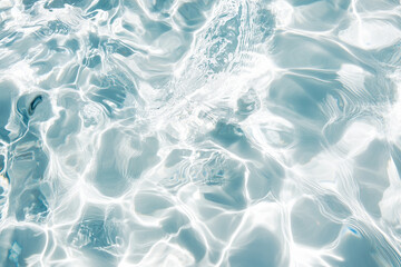 Obraz premium Transparent clear abstract water waves with sunlight shadows on white background close up detail, beauty and skincare concept.