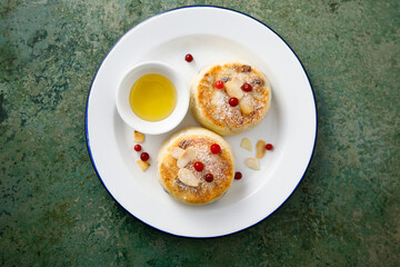 Homemade curd cakes with honey and almond