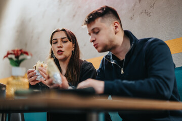 Friends enjoying food together in a casual and friendly restaurant setting