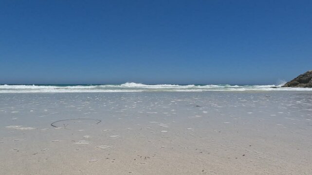Low angle view of waves on the shore at Claytons beach, Mindarie Perth Australia