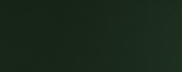 Fototapeta premium A smooth, dark green surface with a subtle texture, providing a rich and calm aesthetic.