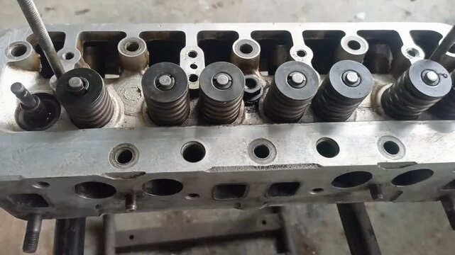  cylinder car engine block. Car engine components being repaired.