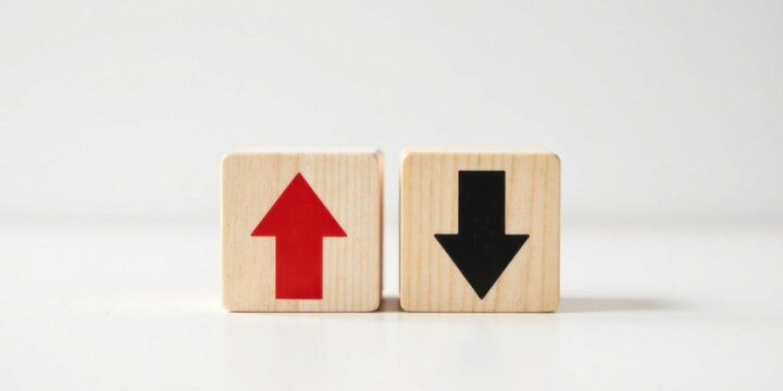 Wooden blocks with opposing directional arrows symbolizing contrasting trends, choices, or opposing forces.