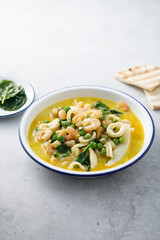 Seafood curry with green pea and spinach