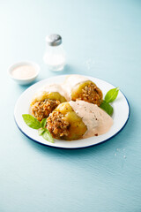 Stuffed peppers with beef, rice and sour cream sauce