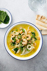 Seafood curry with green pea and spinach
