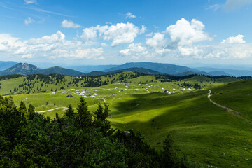 Velika Planina, Kamnik, Slovenia. Lord of the Rings style village. Wooden typical houses, hills,...
