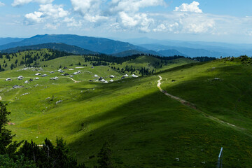 Velika Planina, Kamnik, Slovenia. Lord of the Rings style village. Wooden typical houses, hills,...