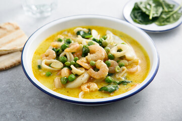 Seafood curry with green pea and spinach