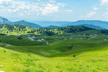 Velika Planina, Kamnik, Slovenia. Lord of the Rings style village. Wooden typical houses, hills,...
