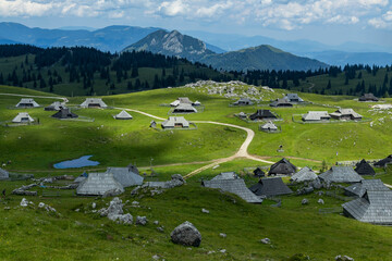 Velika Planina, Kamnik, Slovenia. Lord of the Rings style village. Wooden typical houses, hills,...