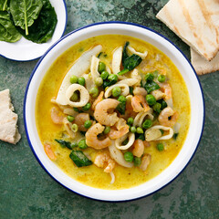 Seafood curry with green pea and spinach