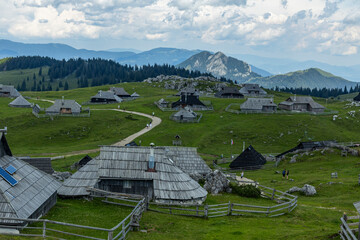 Velika Planina, Kamnik, Slovenia. Lord of the Rings style village. Wooden typical houses, hills,...