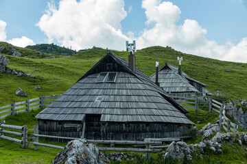 Velika Planina, Kamnik, Slovenia. Lord of the Rings style village. Wooden typical houses, hills,...