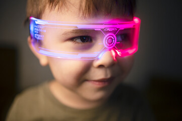 Child wearing futuristic smart glasses with glowing neon lights indoors