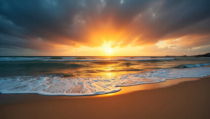 Obraz premium Landscape image of a serene beach scene at sunset, with a sandy shoreline in the foreground and gentle waves lapping against it