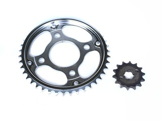 A pair of high quality motorcycle front and rear gears isolated on a white background
