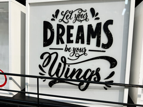 Motivational poster with inspirational quote encouraging dreams and aspirations