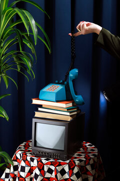 Vintage elegant office studio shoot with a telephone, books, and television