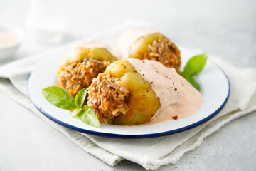 Stuffed peppers with beef, rice and sour cream sauce