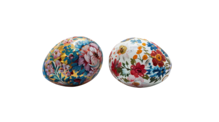 Two hand-painted easter eggs with floral motifs on transparent background