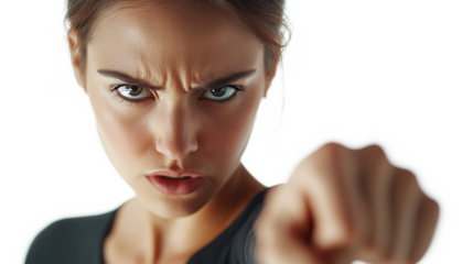 Close-up of young woman in black dress with serious eyes and pointing finger at camera on transparent background