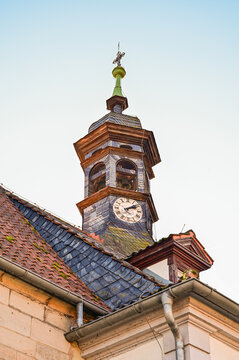 Historic roof turret with a clock and slate cladding on the town hall in Ludwigsstadt, Frankenwald, Upper Franconia, Bavaria, Germany