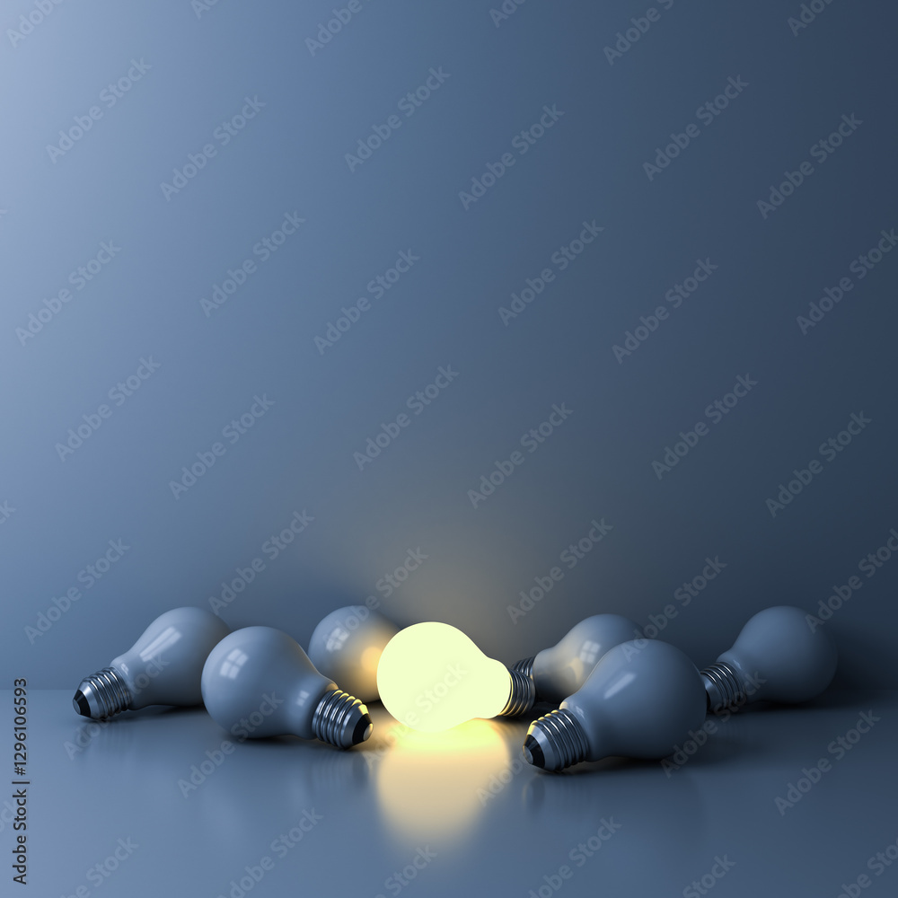 Poster one glowing light bulb among the unlit incandescent bulbs or stand out from the crowd in the dark ro