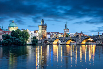 View of the Vltava river and Charles bridge at night, Prague cityscape, Czech republic