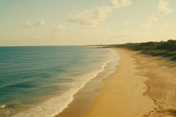 Fototapeta premium Tranquil Seaside View with Gentle Waves and Sandy Beach at Dusk