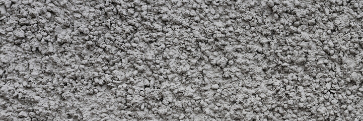 Painted plastered wall. Rough surface. Wall texture for background and design. Closeup.