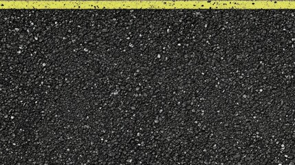 Fototapeta premium Textured asphalt road surface with yellow painted line indicating boundary