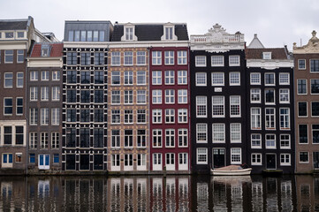 The houses of Amsterdam stand tall and thin