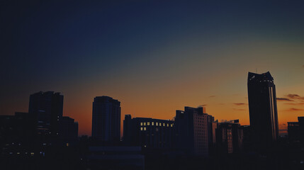 Modern City Skyline at Sunset Silhouette