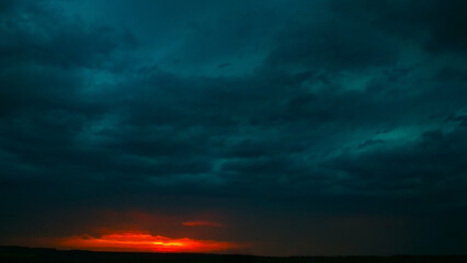 Dramatic sunset with dark clouds