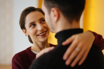 Couple sharing a joyful moment in intimate setting indoors