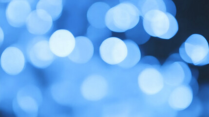 Obraz premium Abstract Blue Bokeh: A mesmerizing display of soft, circular lights creates an ethereal and dreamlike ambiance, perfect for conveying feelings of tranquility, celebration, or wonder. 