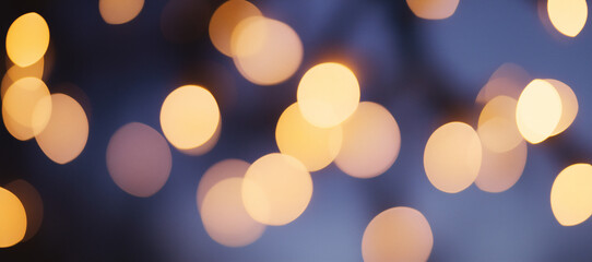 Obraz premium Sparkling Lights Bokeh: An artistic display of blurred, out-of-focus lights, creating a dreamy and atmospheric effect. These radiant orbs evoke warmth and a sense of enchantment.