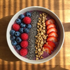 AI-generated A top-down view of a fresh fruit smoothie bowl with vibrant berries, chia seeds, and granola, set on a rustic wooden table, natural lighting