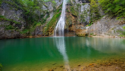 Obraz premium Mystical Waterfall in Foggy Forest