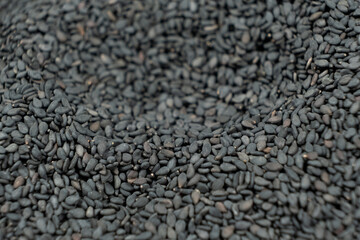 Raw black sesame seeds close-up macro texture
