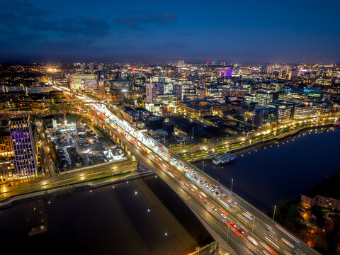 Aerial rush hour traffic M8 motorway highway Glasgow across river Clyde bridge