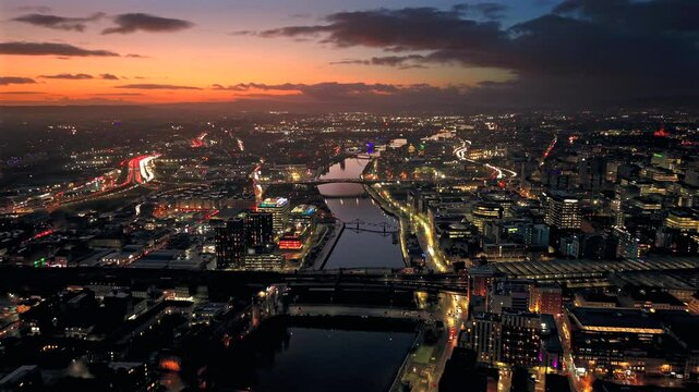 Sunset night aerial city Glasgow Scotland and river Clyde rush hour traffic 
