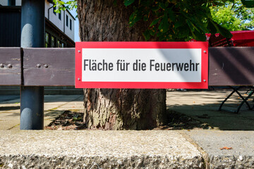 A red and white sign at the Witch Dance Square (Harz Mountains, Germany) indicates this is an area reserved for the fire brigade in case of an fire.