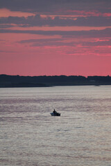 Pink sunset on the water, Norway