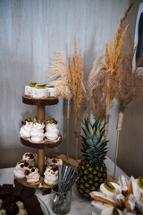Elegant Wedding Candy Bar with Colorful Sweets, Cakes, and Fruits