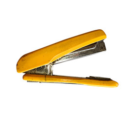 A close-up of a used, mustard yellow stapler on a white background.